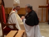 Bishop Vaughan blesses Fr. Guy