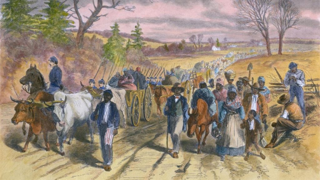 Union soldiers accompanying freed slaves